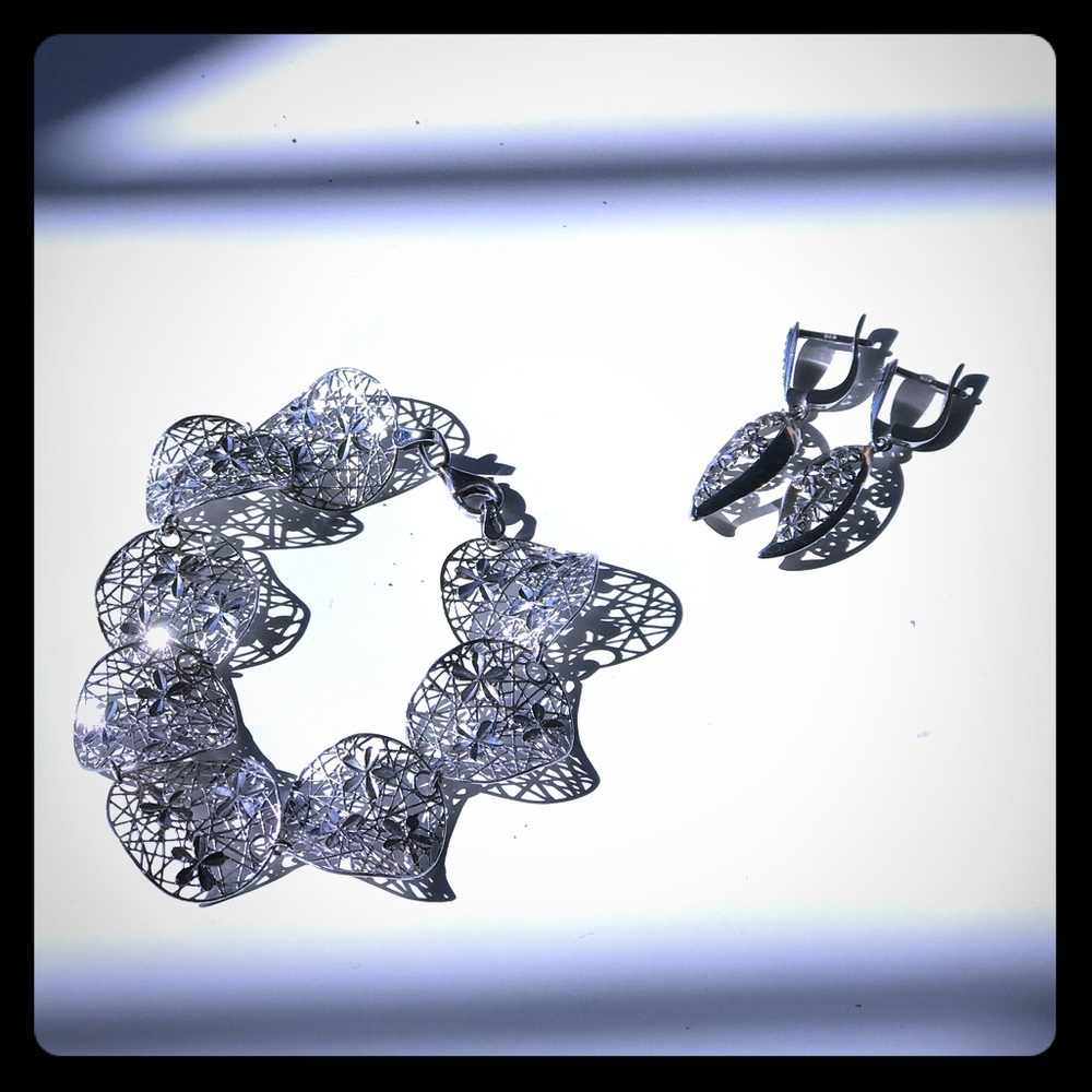 silver bracelet and earnings set